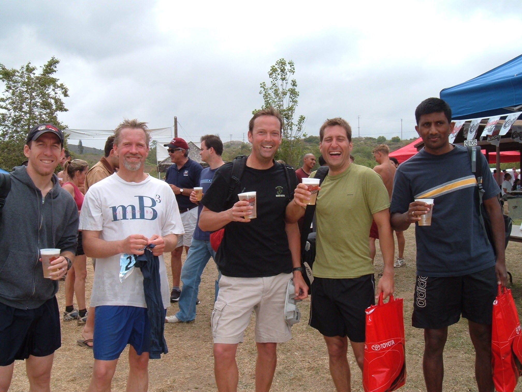 Engineers on a day of recreation at the beach drinking bear
